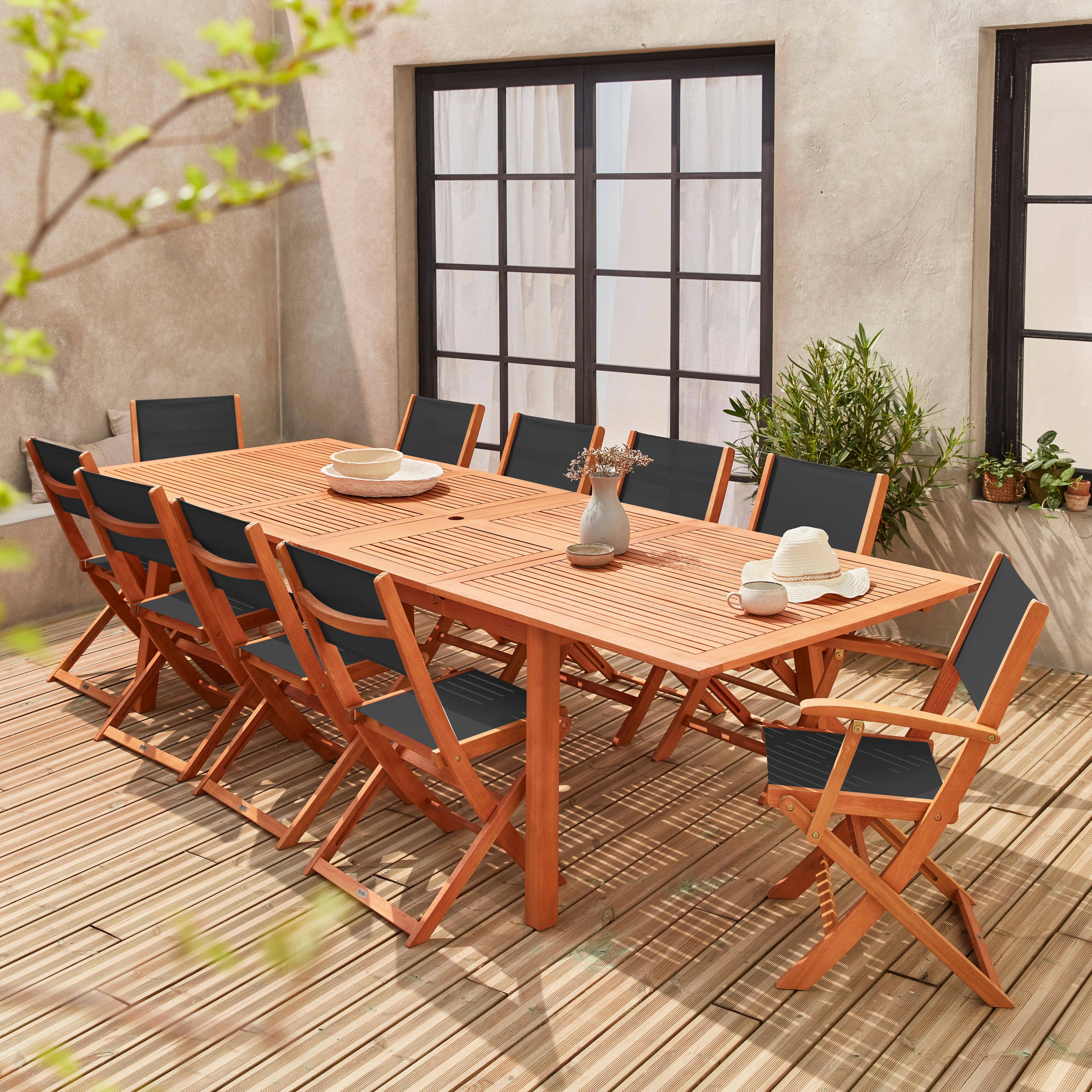 Ausziehbares Gartenmöbelset aus Holz - Almeria Tisch 200/250/300cm mit 2 Verlängerungsplatten, 2 Sesseln und 8 Stühlen, aus geöltem FSC Eukalyptusholz und schwarzem  Textilene Photo1